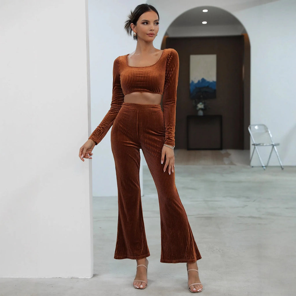 Women's caramel coloured sweater set with long sleeves and matching trousers on hanger