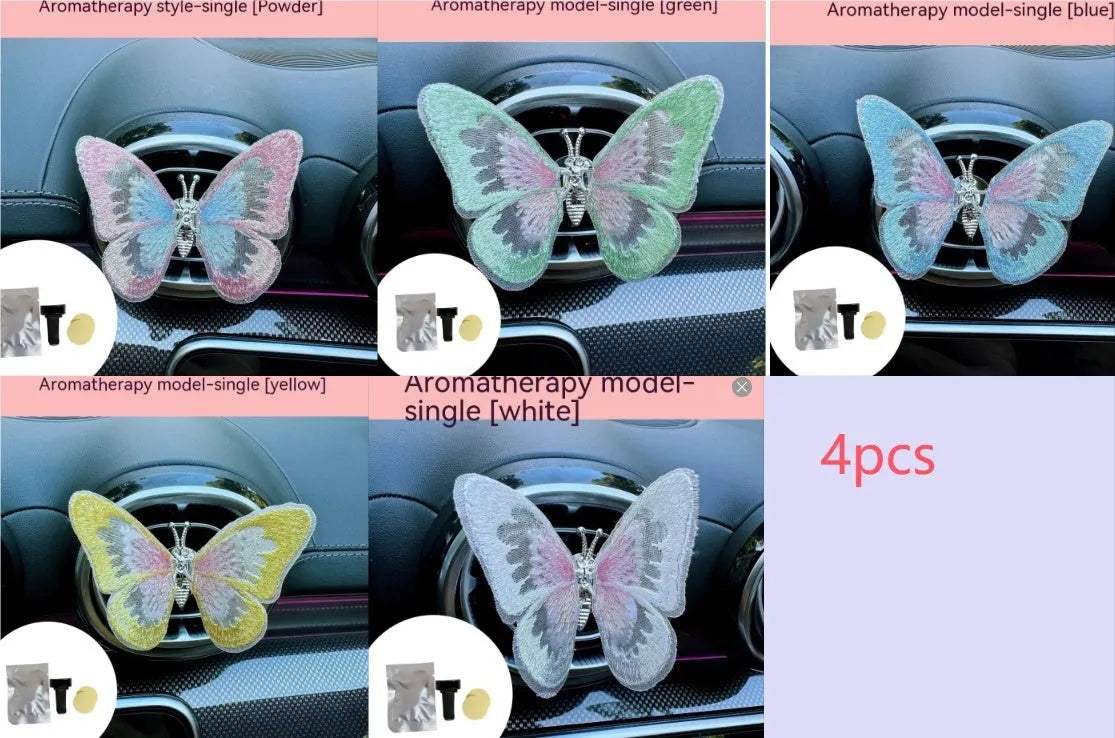 Fabric embroidered butterfly car air vent decoration in multiple colour options on a dashboard.