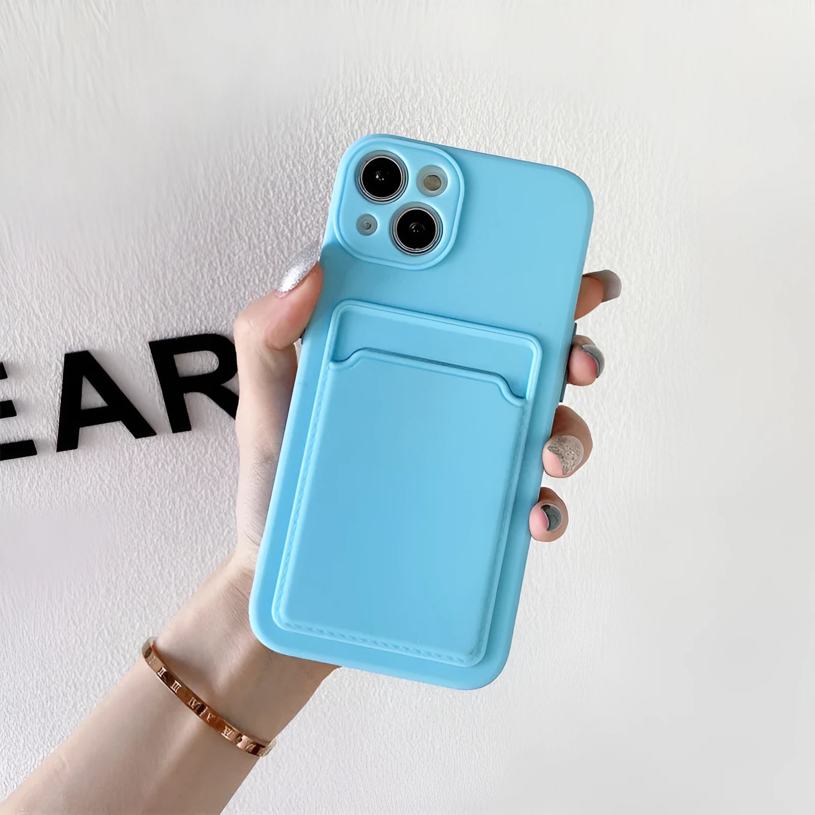 Sky blue silicone iPhone protective case with integrated card slot for multiple iPhone models