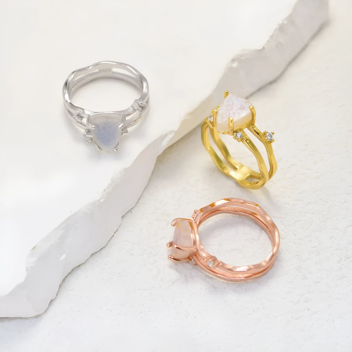 S925 silver irregular triangle moonstone ring in rose gold finish on white background