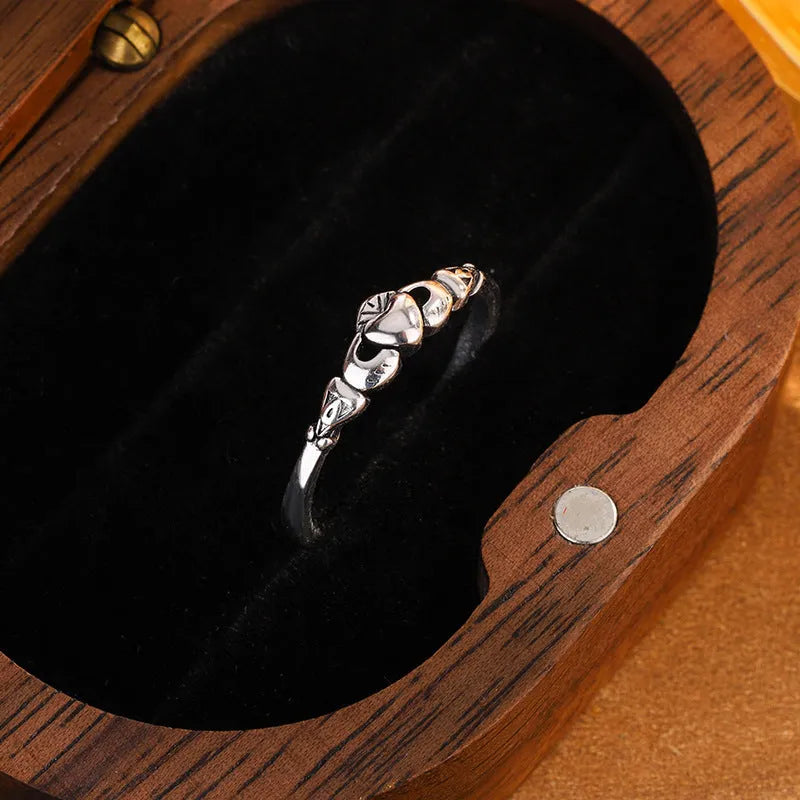 Open ring for women in retro silver with a detailed heart shape design on a copper base.