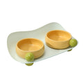 Elevated ceramic pet feeding bowl with two compartments and a non-slip base in a choice of colours.