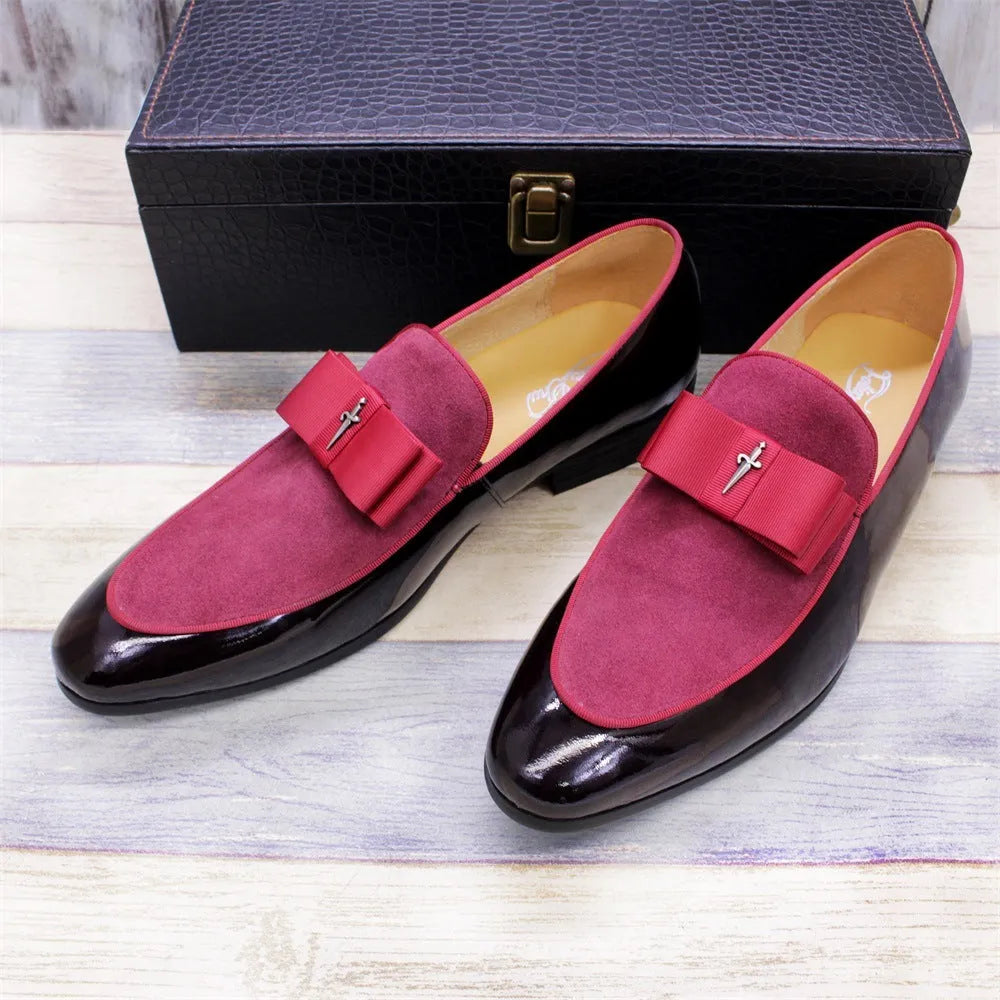 Men's glossy black patent leather low-top shoes with a tassel detail on a white background.