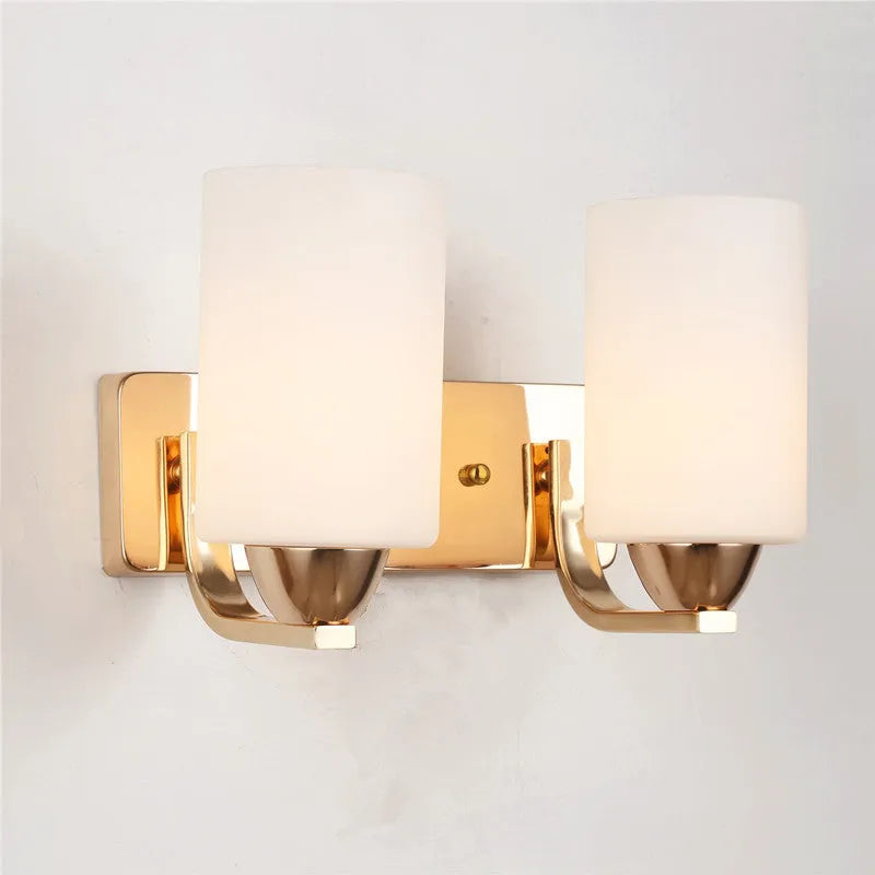 Chrome-finished modern wall lamp with glass shade, shown in single head configuration.