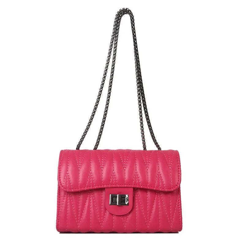 Retro textured diamond pattern women's small handbag in a choice of colours showing front view and internal phone pocket.