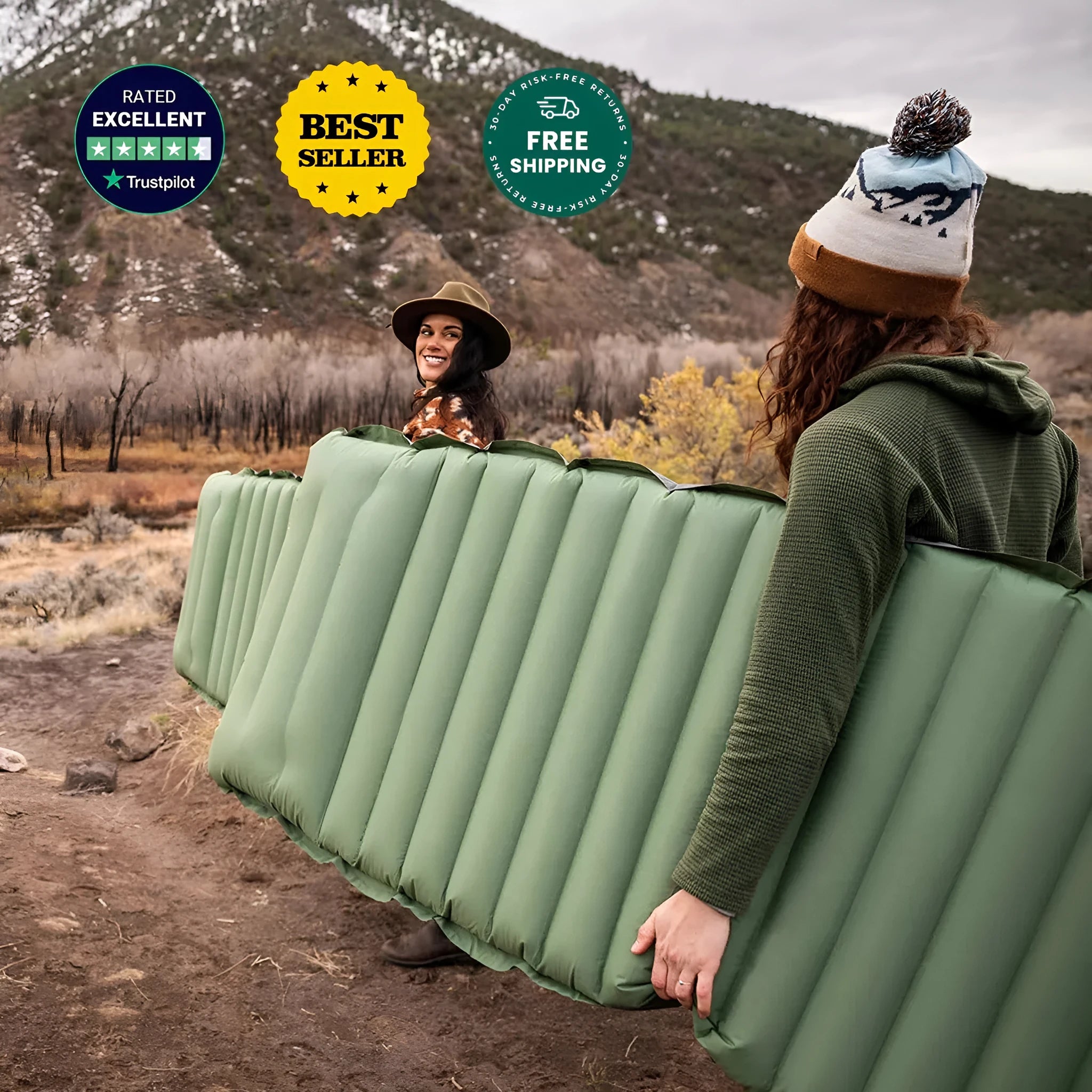 Single-size portable inflatable camping mattress in grey on a tent floor