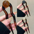 Simple U-shaped acrylic barrettes with ball retro design in beige, caramel, dark gray and green colours