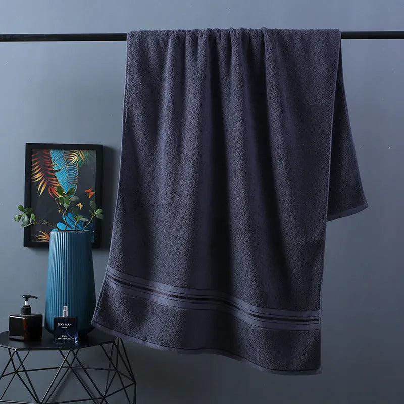 Three-piece cotton bath towel set in floral colours showing bath towel, hand towel and face cloth with optional logo printing
