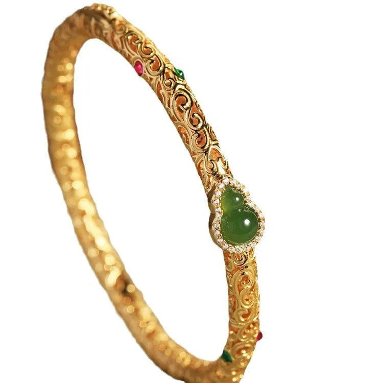 Women's gold-plated silk bracelet with adjustable knot and traditional Chinese xiangyun gourd charm