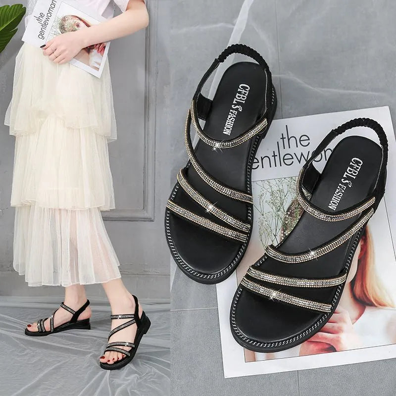 Women's flat sandals with sequin details and elastic band in gold colour