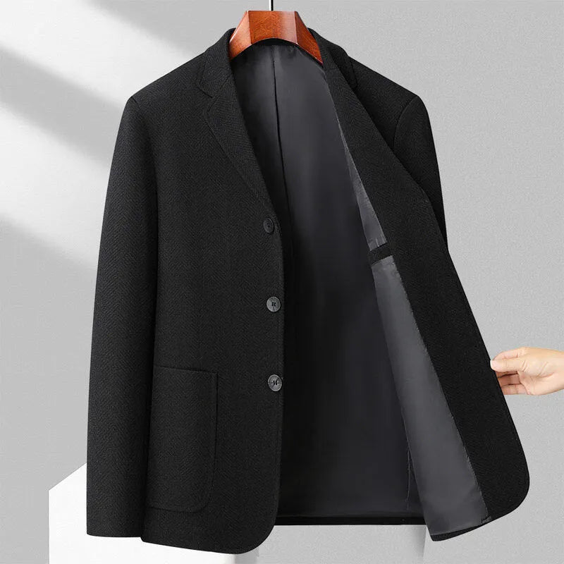 Man wearing a loose-fit solid colour wool-blend coat suitable for spring or autumn casual wear.