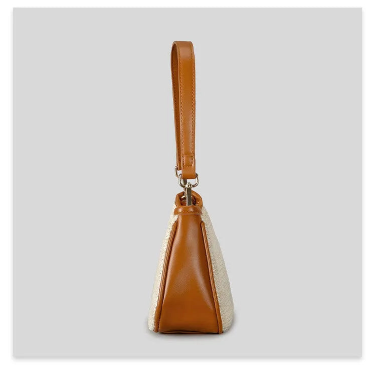 Khaki hand-woven straw crossbody bag with single shoulder strap showing textured PP grass construction