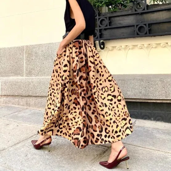 Brown leopard print women's long A-line skirt with a big hem, laid flat.