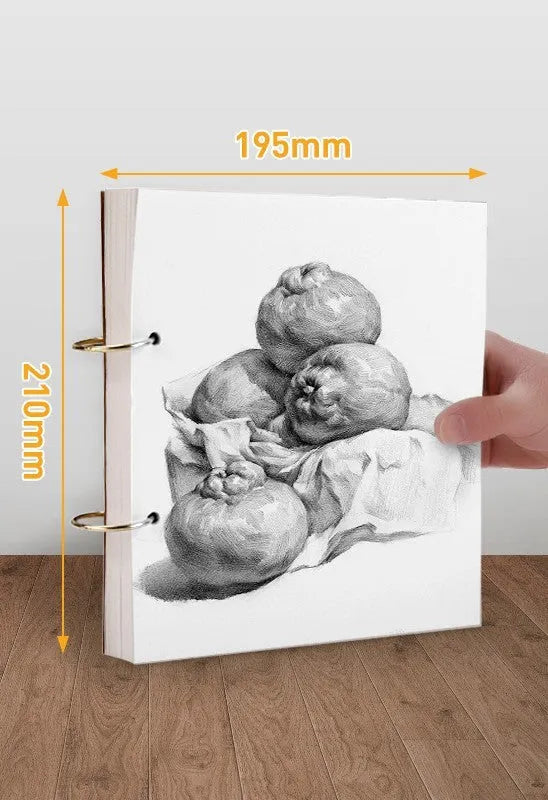 8K thickened sketchbook open on a table with marker drawings, showing linen and black card cover options.