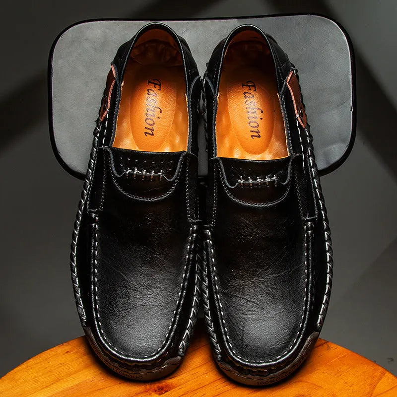 Men's leather casual shoes in black with round toe, shallow opening, and rubber sole