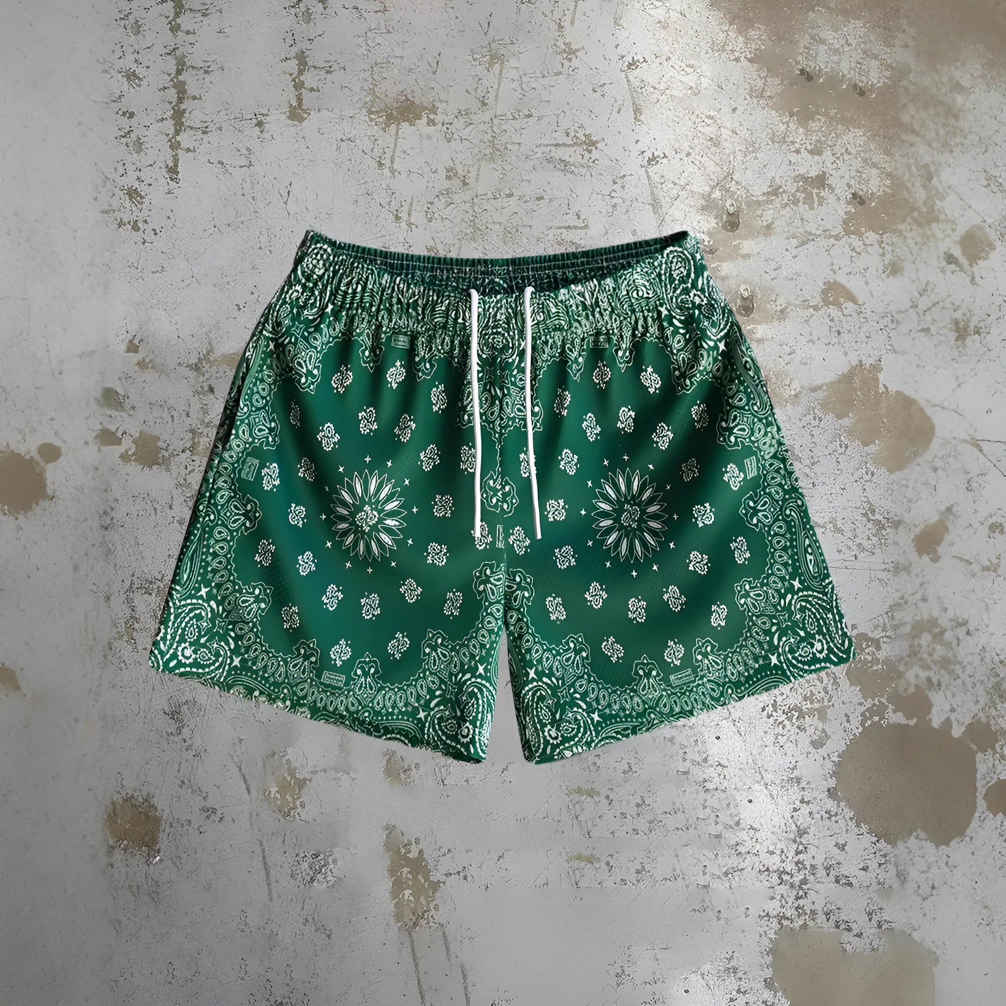 Man wearing loose-fitting digital print beach shorts made from quick-drying milk silk polyester.