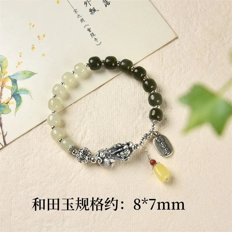 Retro women's pure silver bracelet with a Natural Hetian Jade stone and an 8mm coin charm.