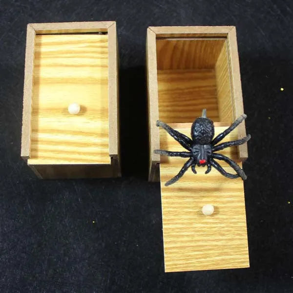 Camellia wood trick box with spider prank element on white background for scary spoof jokes