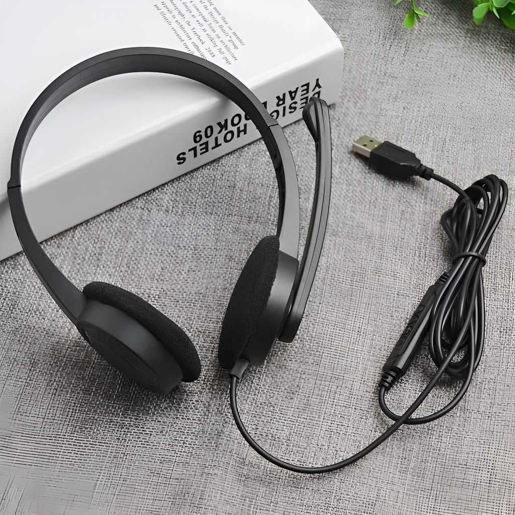 Black wired USB headset with sponge ear cushions and microphone for computer gaming and calls