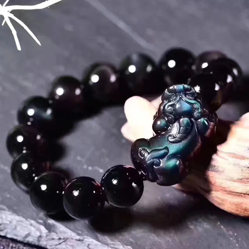 Natural ice colour eye obsidian crystal bracelet with varying bead sizes on wrist
