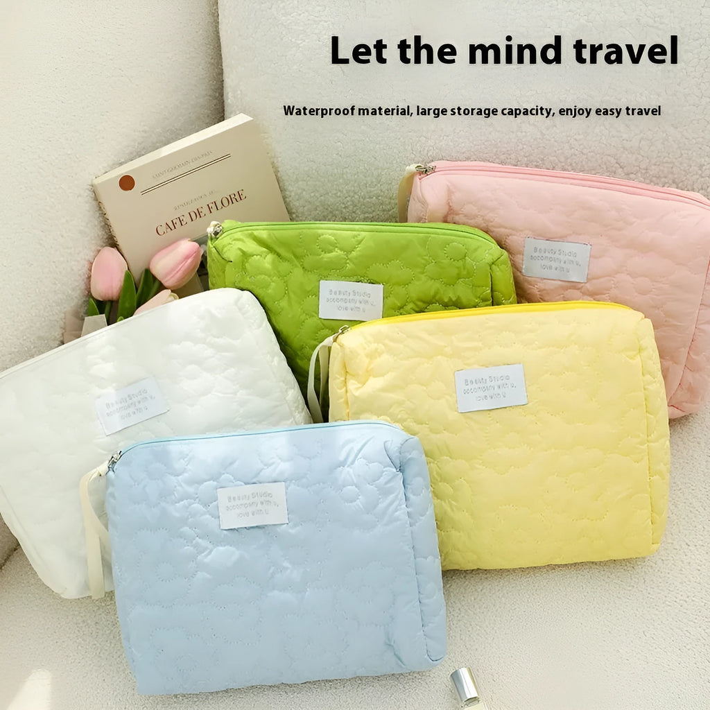 Quilted silk cosmetic bag in multiple colours including pink, blue, green, white, and yellow