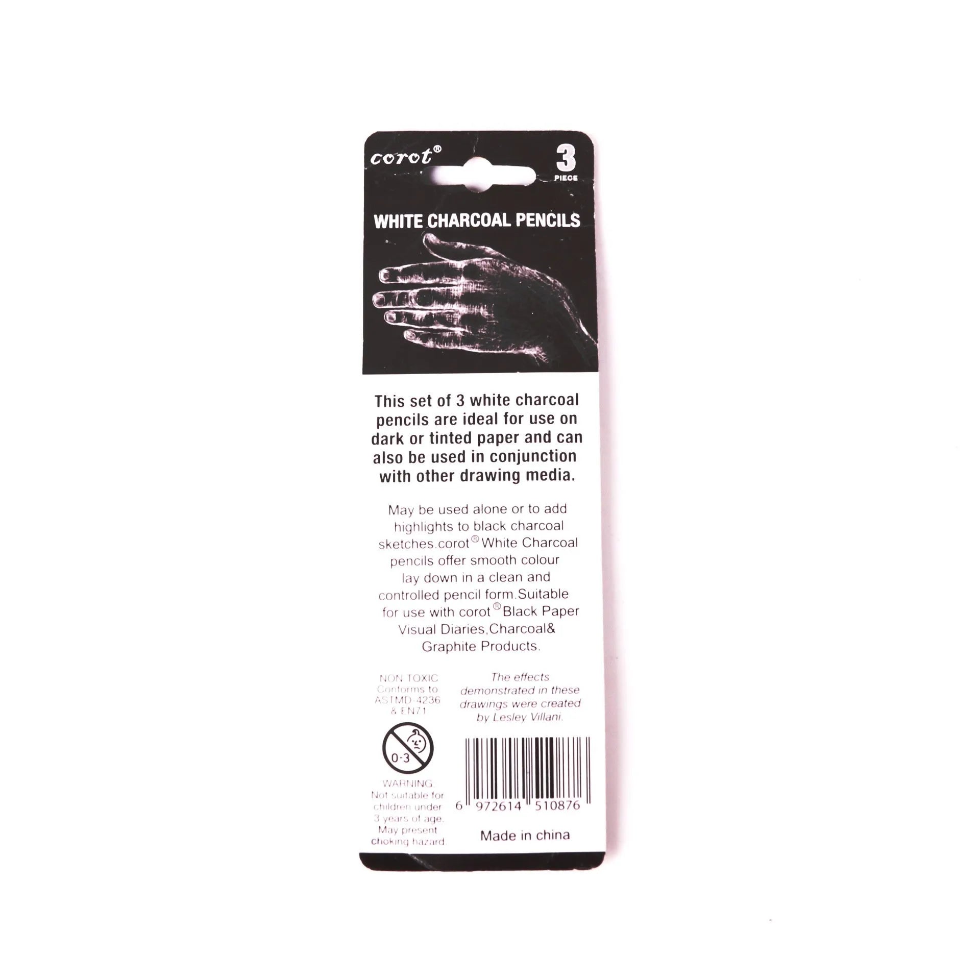 Three white charcoal pencils with wooden casings for sketching and highlighting on dark paper
