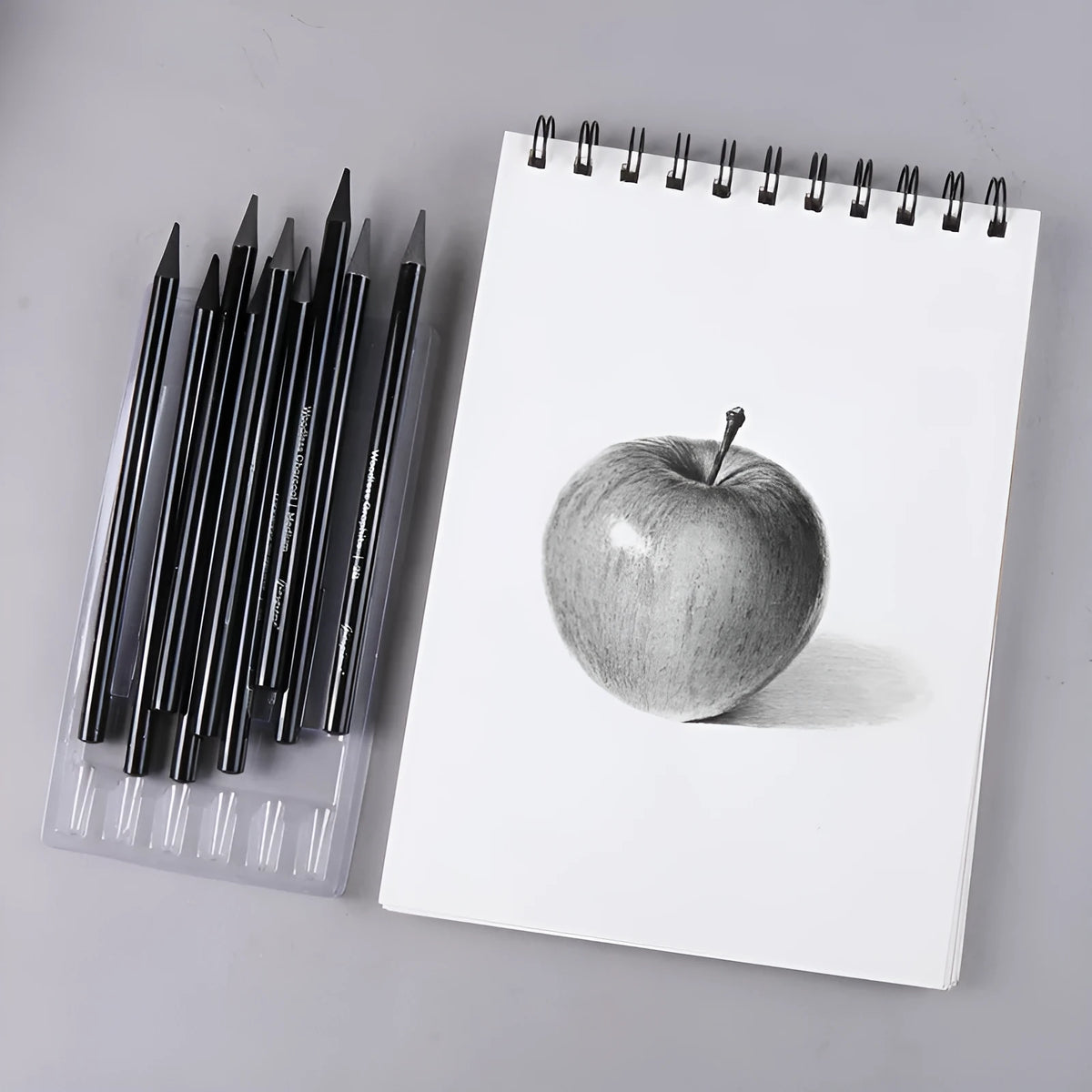 Solid graphite and carbonized pencil set in suction card pack with wooden shell