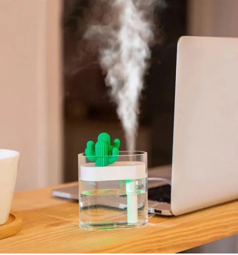 Transparent green cactus-shaped portable USB humidifier on a desk, 120mm tall