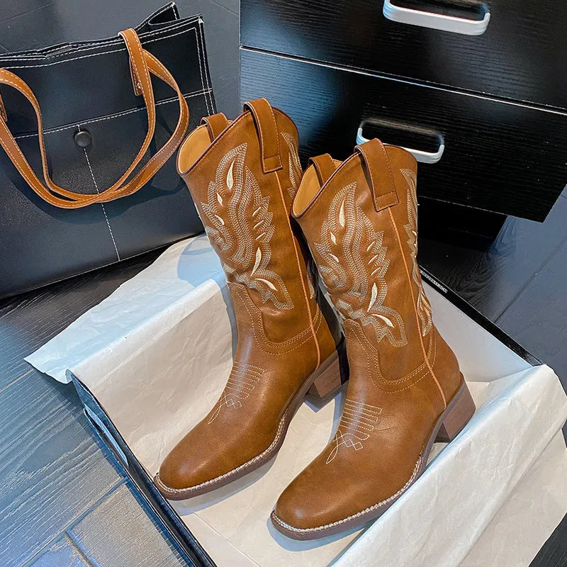 Brown women's mid-calf Martin boots with embroidery detailing and waterproof platform