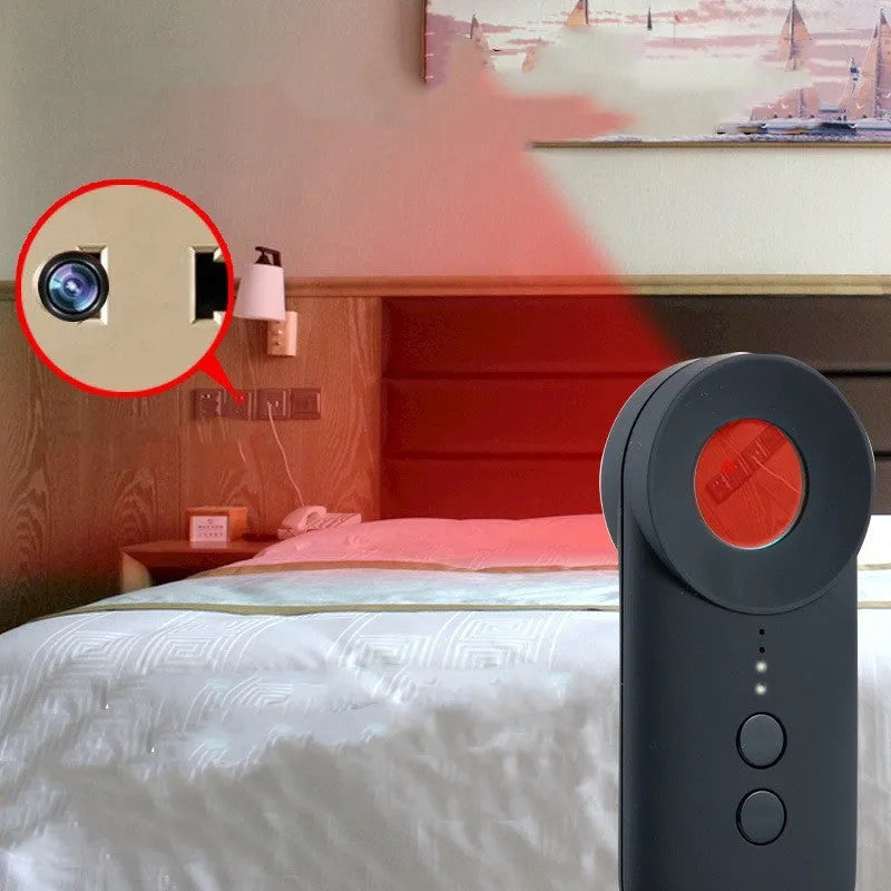 Black portable camera and GPS signal detector with USB charging port on a flat surface.