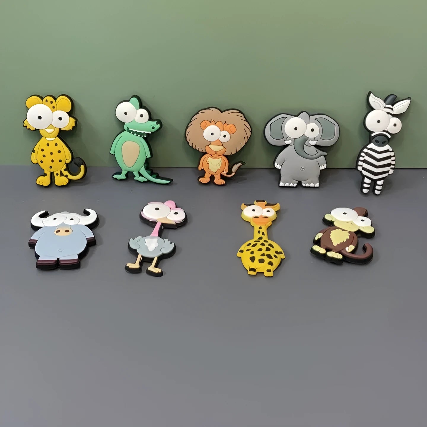 Set of 9 colourful PVC cartoon animal refrigerator stickers on a white fridge surface