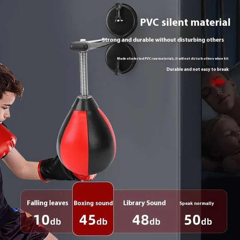 Pear-shaped hanging boxing training ball with red and black head on elastic cord and dual suction cup base.