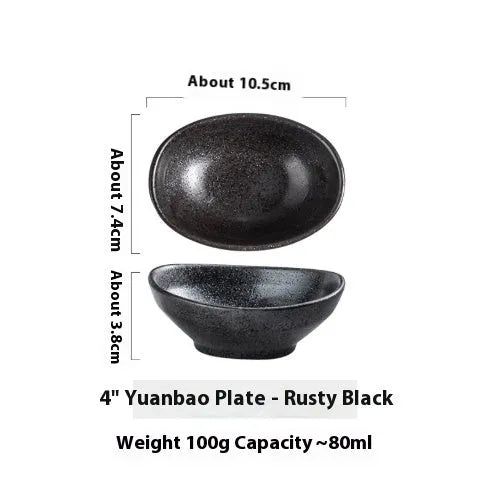 Oval-shaped Japanese ceramic sauce dipping bowl with an underglaze decorative pattern.