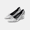 Women's black pointed toe Mary Jane shoes with a distinctive shaped floating heel and slip-on design.