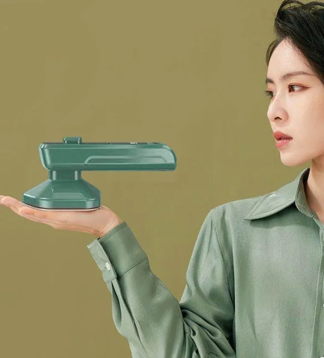 Dark green portable hanging steam ironing machine with ceramic panel.