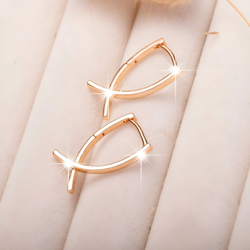 Rose gold copper cross shaped earrings with light luxury aesthetic