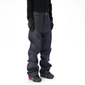 Man's dark blue loose-fit straight leg denim jeans on a neutral background.