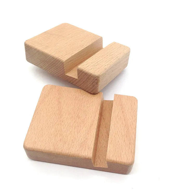 Beech wood and resin lazy bracket mobile phone holder in an animal design style on a desk.