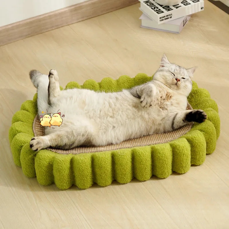 Green oval cat scratcher bed made of sisal, showing scratching surface and lounging area.
