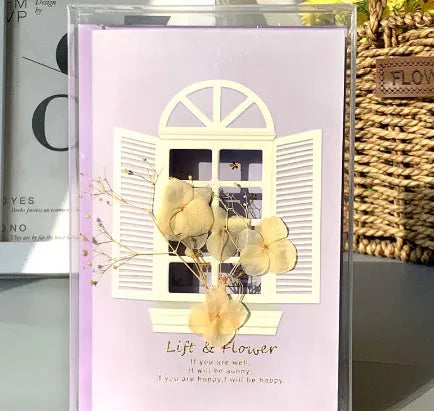 Handmade 3D butterfly-shaped greeting card with artificial flowers in a box, alongside its matching envelope.
