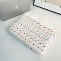 Women's polka dot polyester laptop bag showing front view with storage compartments