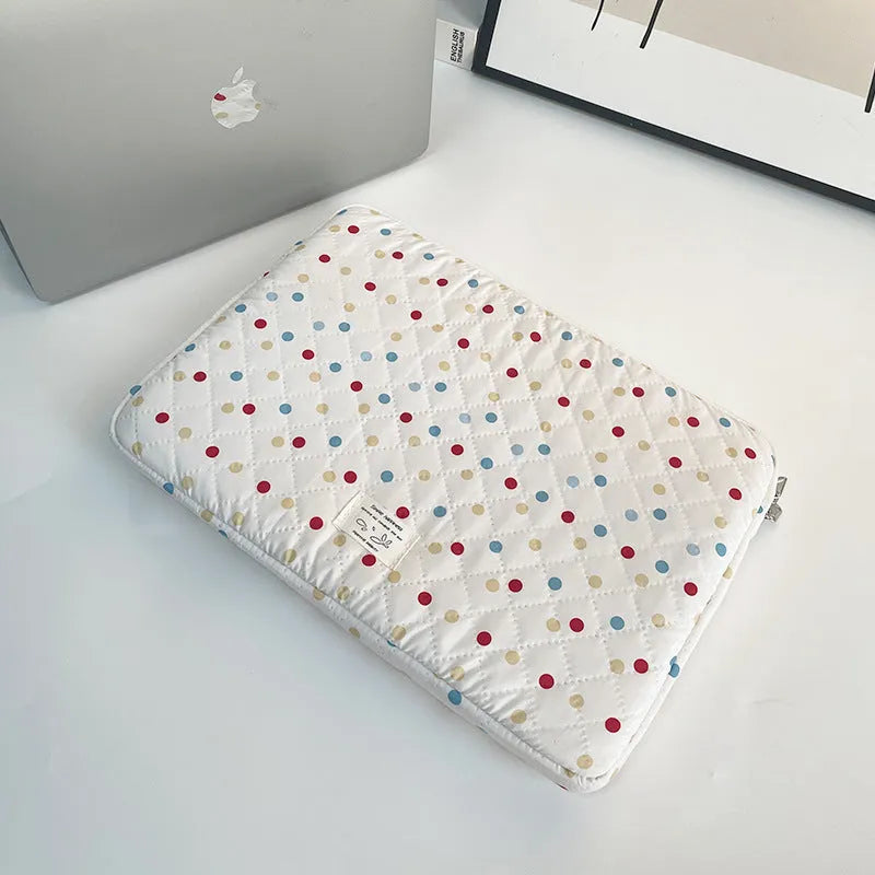 Women's polka dot polyester laptop bag showing front view with storage compartments