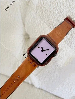 Brown transparent silicone Apple Watch strap showing clear construction and band attachment mechanism