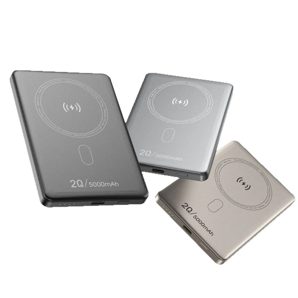 Magnetic wireless power bank with alloy shell in black, compact portable charger on a plain background