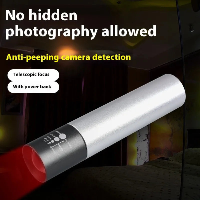 Handheld black aluminium red light mosquito repellent lamp with USB charging cable.