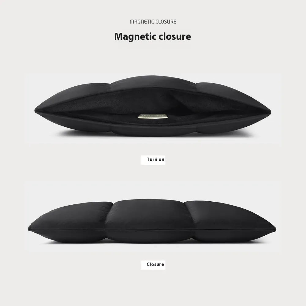 Soft black fluffy laptop sleeve for a 15.6 inch laptop, showing sewn retro style details.