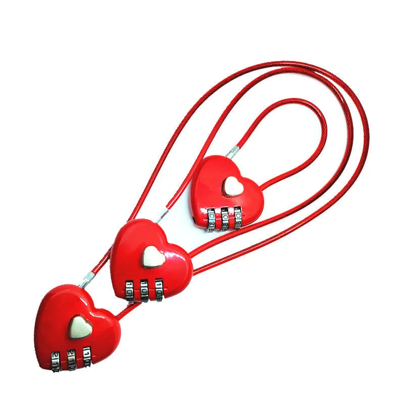 Peach Heart shaped wire rope lock in ABS plastic for securing bicycle helmets.