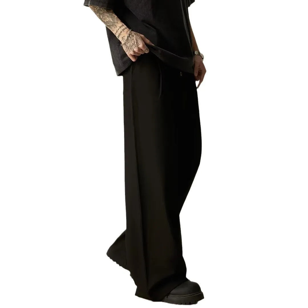 Men's solid colour straight-leg trousers in cotton-polyester blend fabric shown in black and brown colours