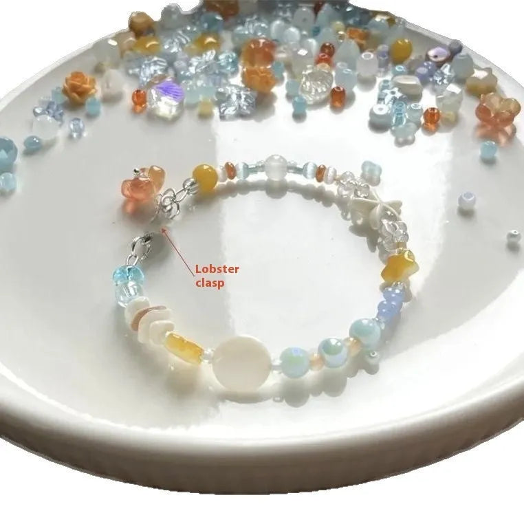 Alloy and mixed material seaside summer charm bracelet in colour Bracelet 0213 with diamond and round shapes.