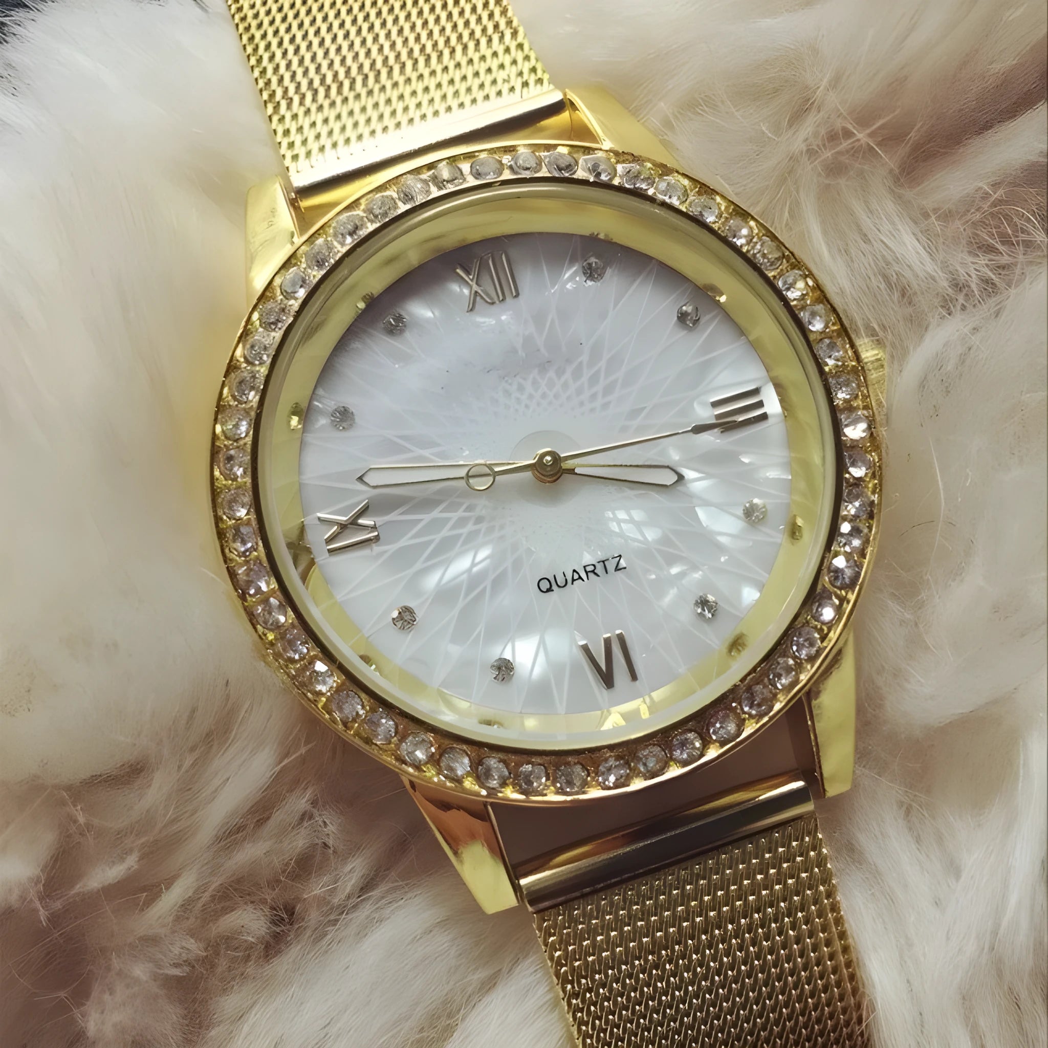 Golden mesh strap alloy electronic watch with round dial and world time GMT functions on a plain background